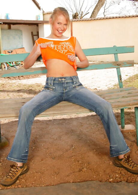 Svelte teen Vera in sexy jeans reveals big titties and spreads her legs outside