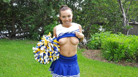 Luscious american young Tiff Bannister in uniform showing big hooters and masturbating outside