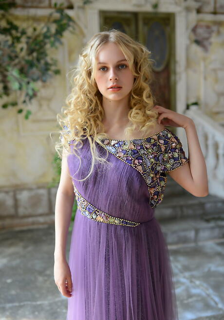 Slim blond teen Nika bares small tits and spreads her legs outside