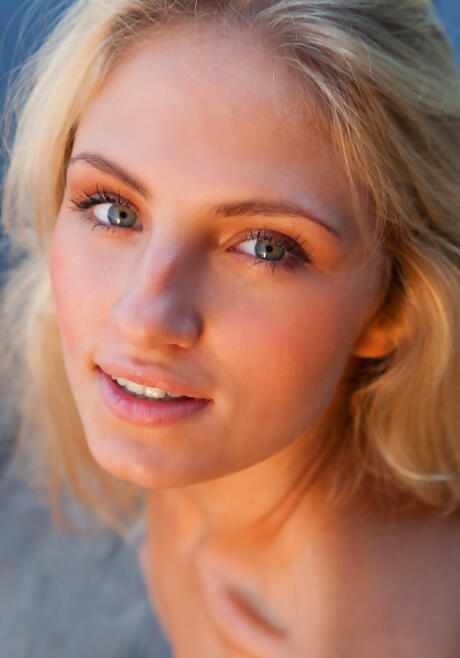 Slim blond teen Jaime A in skirt exhibits tiny tits and spreads her legs outside