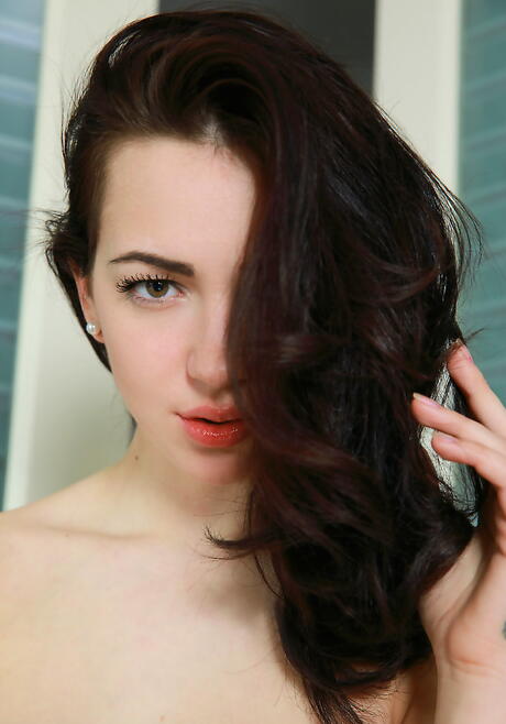 Slim brunette youthful Sivilla revealing tiny tits and spreading her legs 