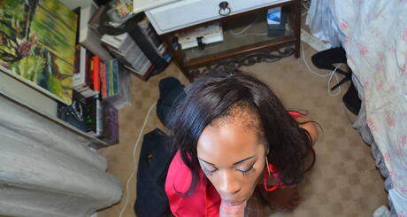 Attractive ebony amateur Carmel Bliss in cosplay clothing sucking deep big cock and takes a cum blast on her face 