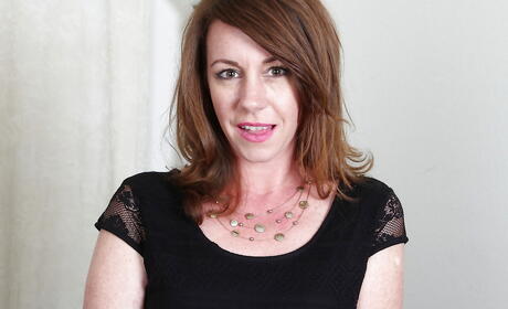 Hot older Joanie Bishop shows her ass in sexy undies and spreading her legs 