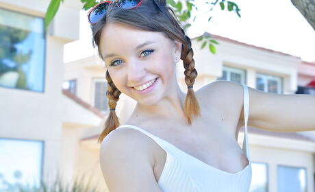 Slender russian teen Aurora Belle in skirt exposing tiny tits and shaved pussy outdoor