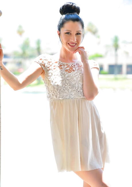 Hot dark-haired hottie Carrie bares her ass in skirt and masturbates with sex toy outside