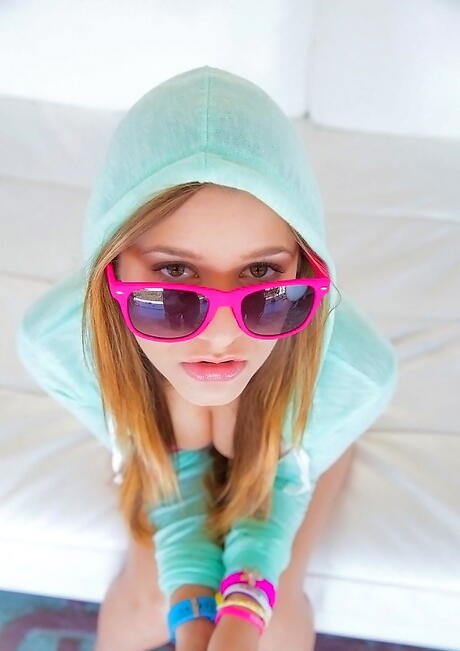 Very attractive american teen Teddi Rae in glasses revealing big tits and sexy ass 