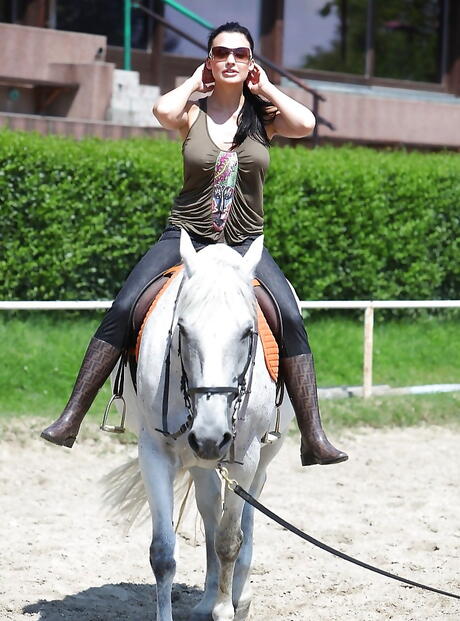 Sexy hungarian pornstar Aletta Ocean in sexy glasses posing outdoor