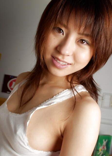 Slender japanese teen Haruka Tsukino reveals tiny tits and spreads her legs 