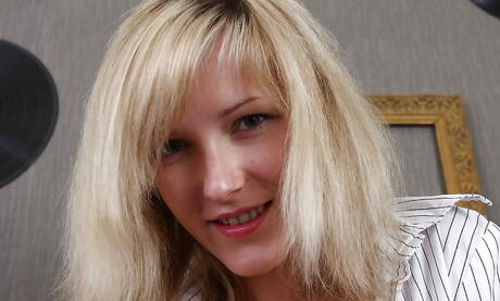 Very attractive blond young Olive uncovering small tits and masturbating 