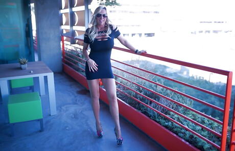 Enchanting american blonde homemaker Sandra Otterson in nice skirt showing her beauty outdoor