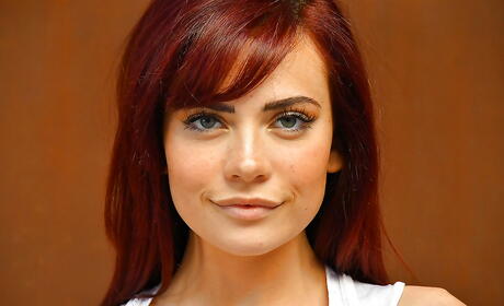 Slender american redheaded young Sabina Rouge in fancy skirt exposing tiny tits and spreading her legs outdoor