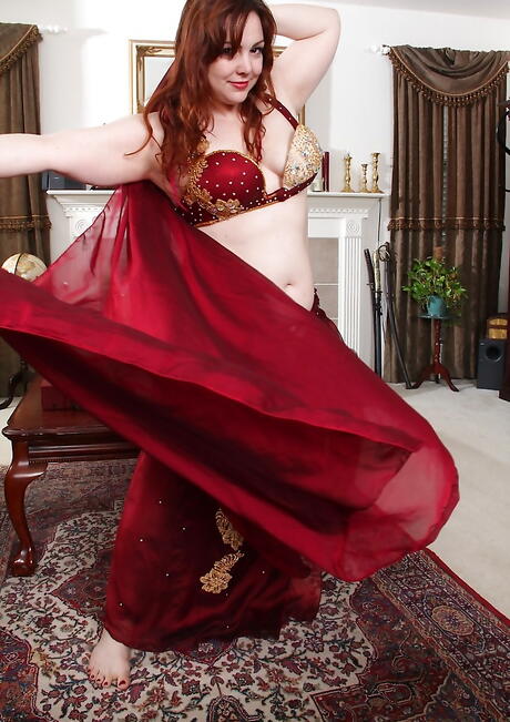 Seductive british redheaded mature Ember Rayne exposes big tits and masturbates 