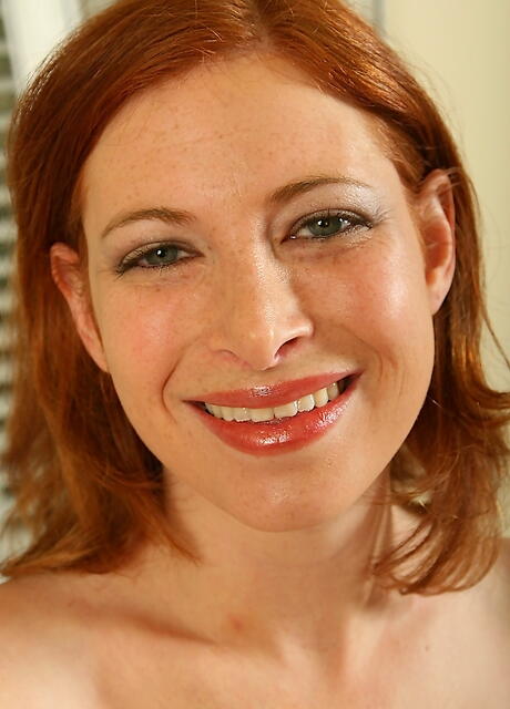 Hot red-haired milf Ginger Moans in undies exposing big hooters and pussy 