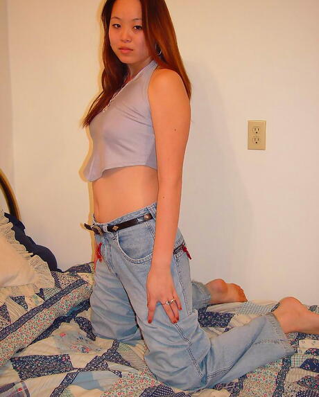 Gracile oriental teen China in sexy jeans exhibiting her butt and cute pussy 