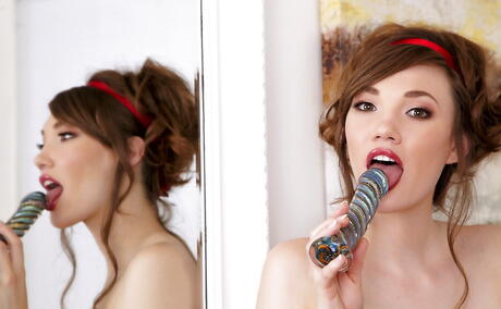 Sultry american pornstar Aria Amor in hot underwear bares her butt and toys her twat in bathroom