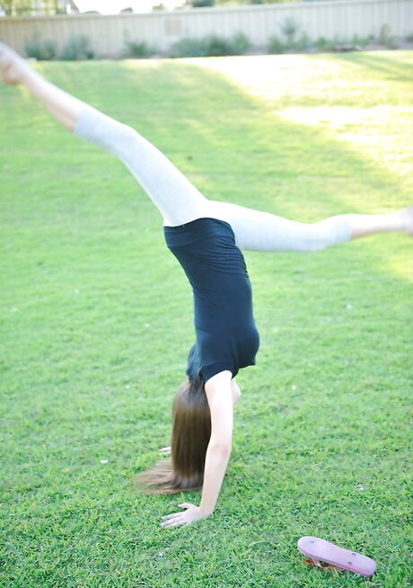 Sylphlike dark hair youthful Orianna in glasses denudes big boobs and pussy outside