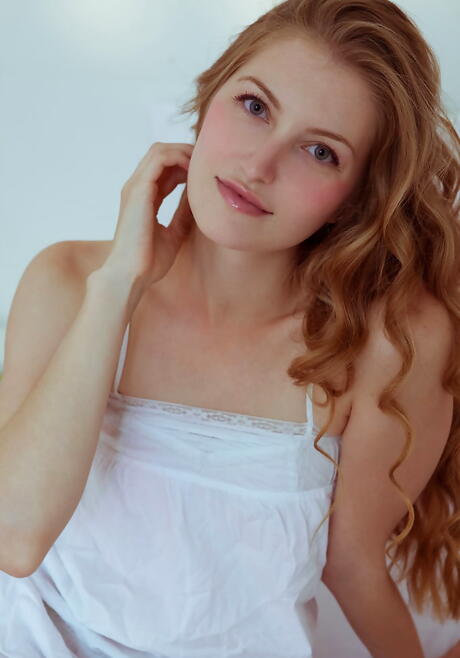 Excellent blonde youthful Bretona uncovering small tits and shaved pussy 