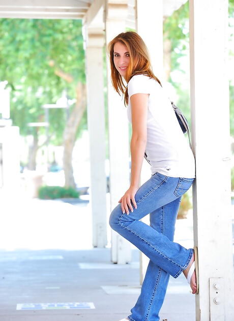 Svelte american young Thena Sky in tight jeans revealing tiny tits and nice pussy outdoor