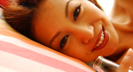 Gracile japanese young Honoka in sexy panties revealing tiny tits and spreading her legs 