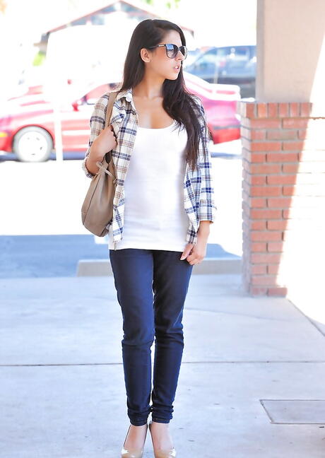 Attractive cutie Lilly Anderson exhibiting her butt outdoor