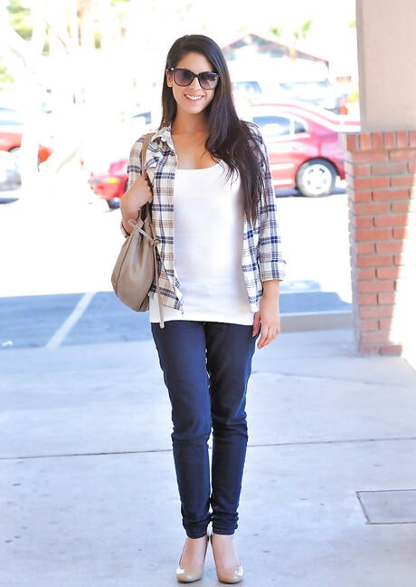 Attractive cutie Lilly Anderson exhibiting her butt outdoor