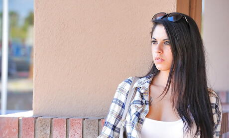 Attractive cutie Lilly Anderson exhibiting her butt outdoor