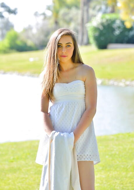 Slim young Lacey shows tiny tits and spreads her legs outdoor