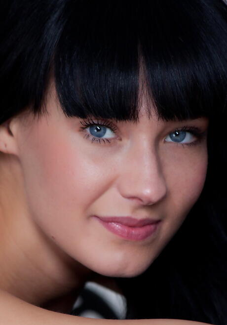 Rangy dark-haired youthful Angel E reveals tiny tits and bald pussy 