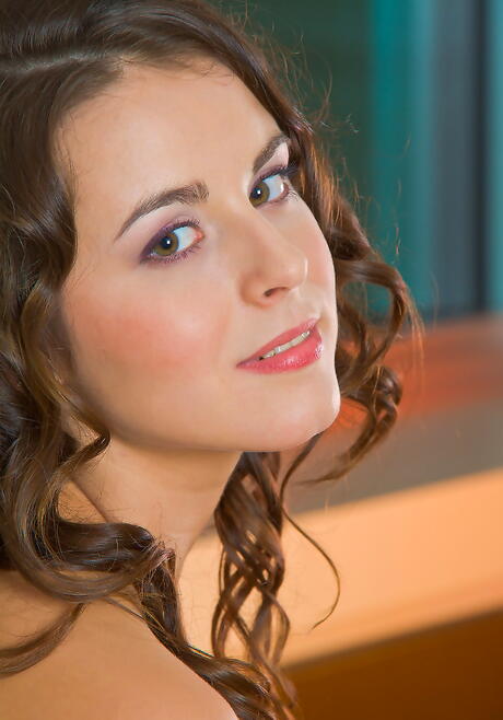 Slim dark-haired hottie Milana J exposing small tits and spreading her legs 