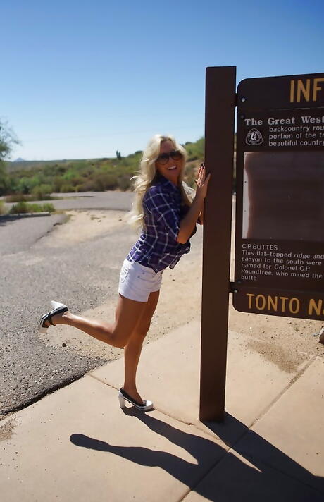 Alluring american blonde wife Sandra Otterson bares big titties and ass outdoor