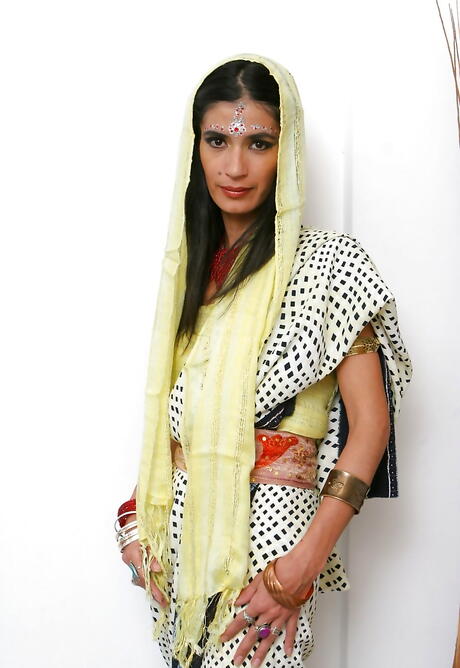 Curious indian cutie Tamara playing with toy 