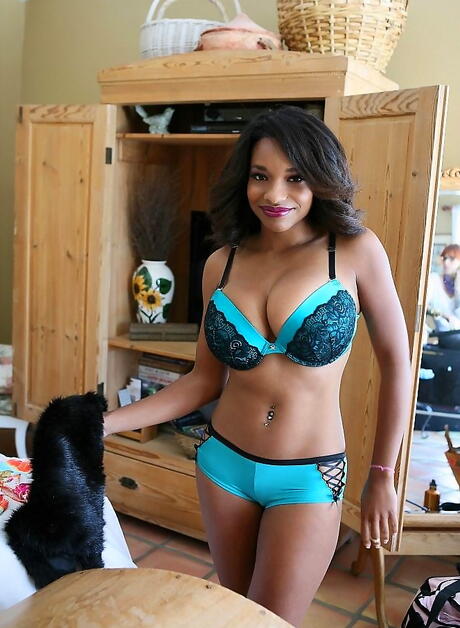 Seductive latin cutie Andrea Marquez in hot underwear showing big hooters and undressing 