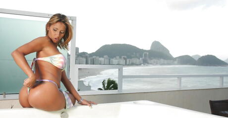 Attractive brazilian cutie Suzy Anderson bares big hooters and sexy butt in bathroom