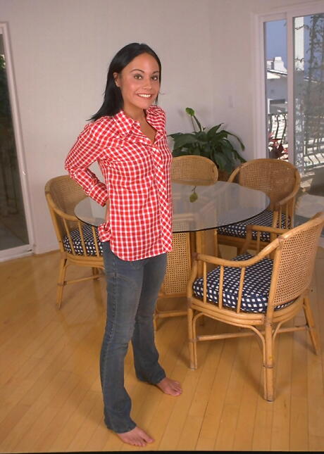 Foxy dark hair teen Arlyn in tight jeans exhibiting her butt and shaved pussy 