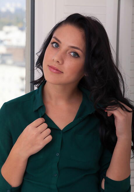 Slender dark-haired young Kantata exposes small tits and shaved pussy 