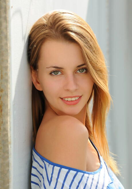 Slender dark hair young Lucia D denudes tiny tits and bald pussy outdoor