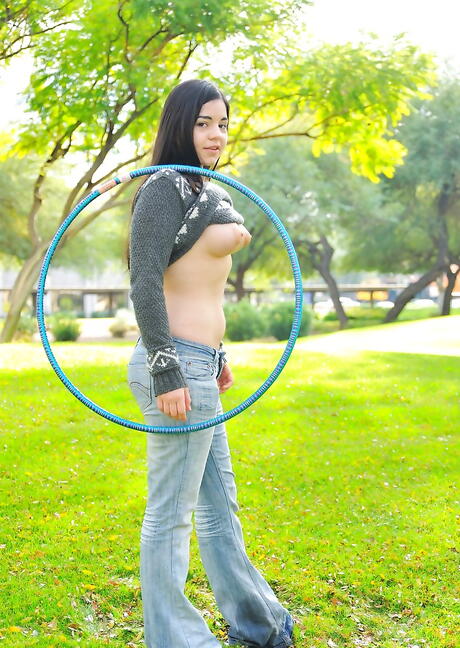 Inviting brunette teen Nadine Sage in tight jeans showing big tits and hot ass outdoor