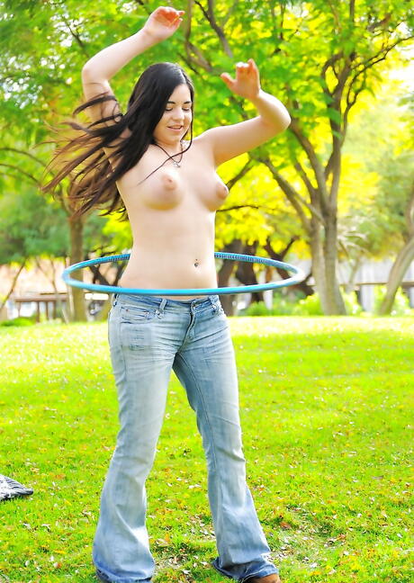 Inviting brunette teen Nadine Sage in tight jeans showing big tits and hot ass outdoor