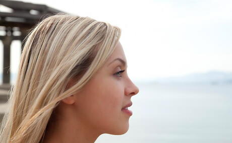 Luscious blond teen Luciana A denudes big knockers and spreads her legs outside