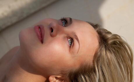 Luscious blond teen Luciana A denudes big knockers and spreads her legs outside