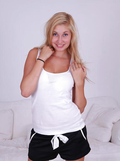 Sexy blond teen Holly Anderson showing small tits and cute pussy 