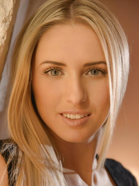 Luscious russian blonde cutie Jessi Gold in sexy skirt exhibits small tits and ass 