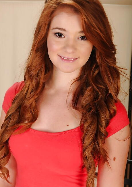 Very attractive american redhead teen Ava Sparxxx exposing small tits and spreading her legs 