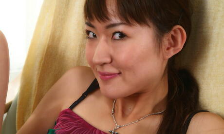 Shapely asian dark hair teen Kuki exposing tiny tits and hairy pussy 