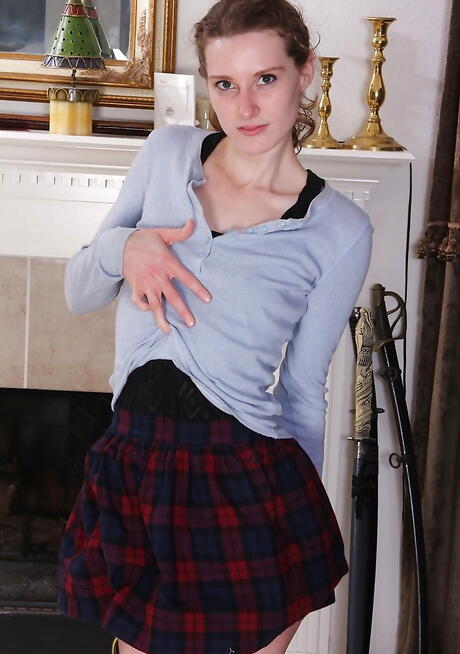 Stunning young Tara Estell showing tiny tits and spreading her legs 