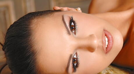 Attractive american milf Eve Angel in hot stockings shows big hooters and puts a toy in her cunt 