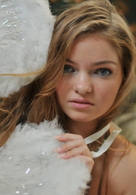 Slim blond young Bridgit A in jeans exposes tiny tits and bald pussy 