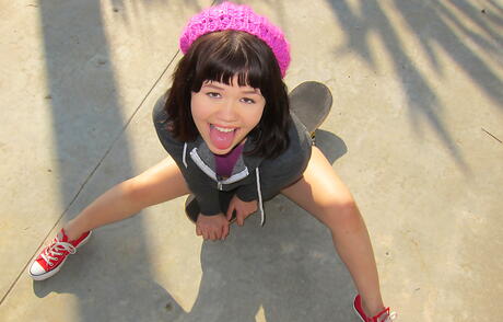 Sexy oriental brunette teen Yhivi in fancy shorts exhibits tiny tits and hot ass outdoor