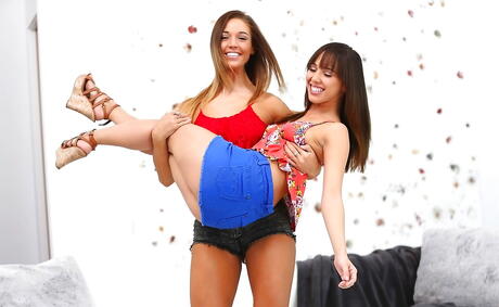 Sexy women Jenna Sativa and Val Midwest in sexy shorts licking pussies and enjoying with dildo 