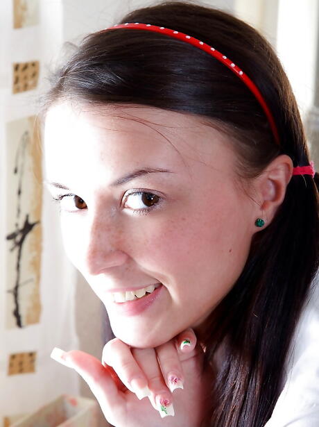 Slender dark-haired teen Zoya in uniform revealing her ass and spreading her legs 